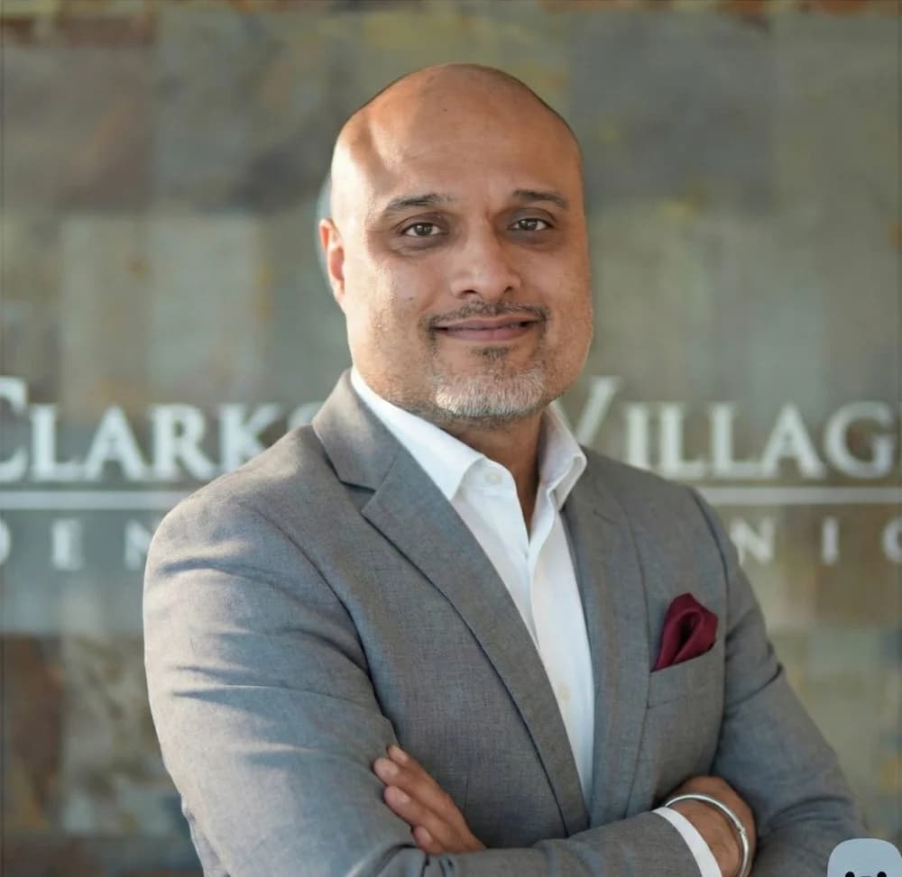 Dr. Ravi Sandhu, owner and lead dentist at Clarkson Village Dental Clinic